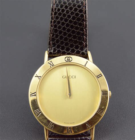 gold and leather watch gucci|Gucci watch with leather band.